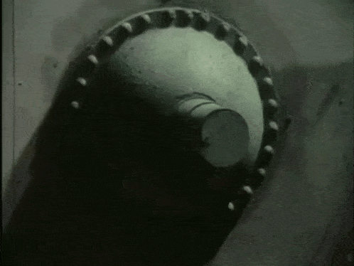 a black and white photo of a metal pipe