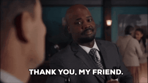 a man in a suit says " thank you my friend "