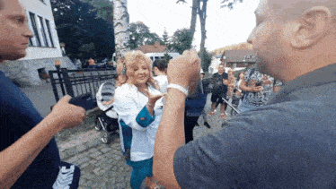 a man wearing a nike shirt is talking to a woman