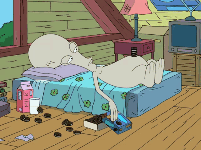 a cartoon character is laying on a bed next to a box of milk and cookies