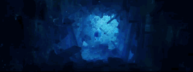 a cave with a light coming out of the top of it