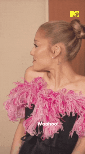 a woman in a black dress with pink feathers and the words woohoo