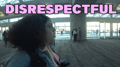a woman stands in a room with the words disrespectful written above her
