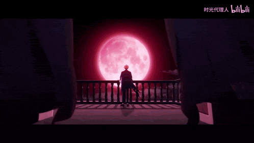 a man is standing in front of a red full moon .