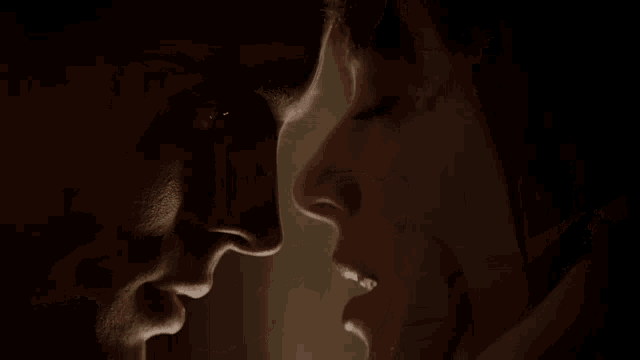 a close up of a man and woman 's faces