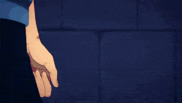 a close up of a person 's hand with a blue shirt