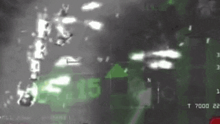 a black and white photo of a helicopter flying over a forest with a green arrow pointing up .