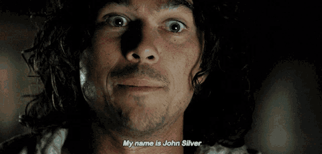 a close up of a man 's face with the words " my name is john silver "
