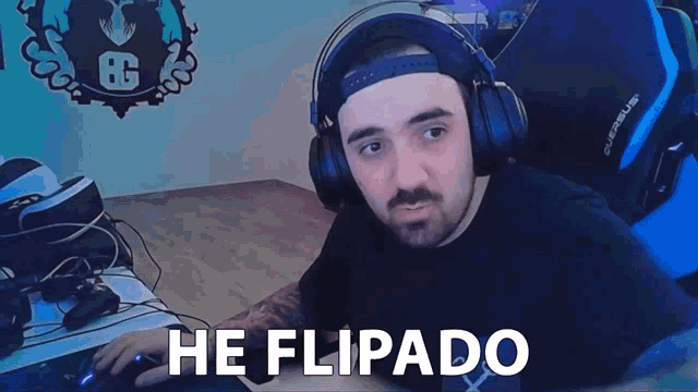 a man wearing headphones says he flipado while sitting in a chair