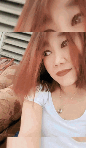 a close up of a woman 's face with red hair