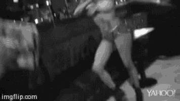 a black and white photo of a woman with yahoo written on the bottom right