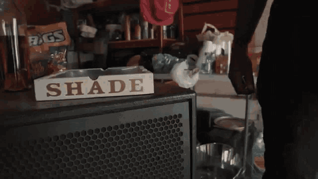 a ludwig drum set in a garage with a man playing a guitar