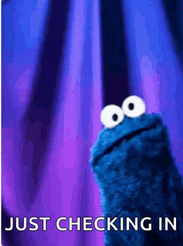 a cookie monster says just checking in in front of a blue curtain