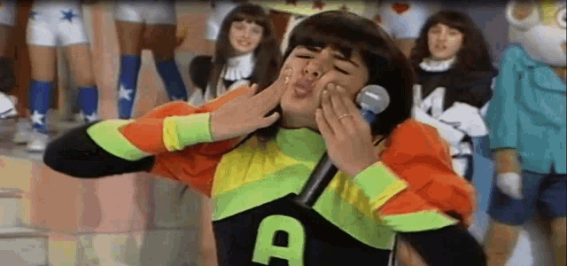 a person in a colorful outfit with the letter a on it