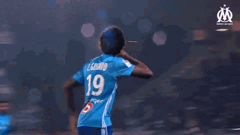 a group of soccer players wearing blue jerseys with the number 19 on them