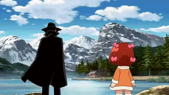 a man and a girl are standing in front of a lake and mountains