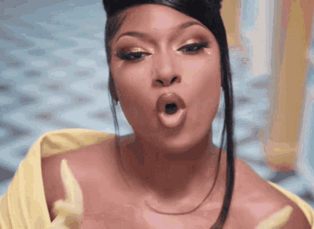 a close up of a woman with her mouth open