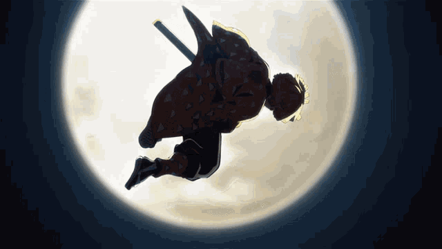 a silhouette of a man with a sword flying in the air