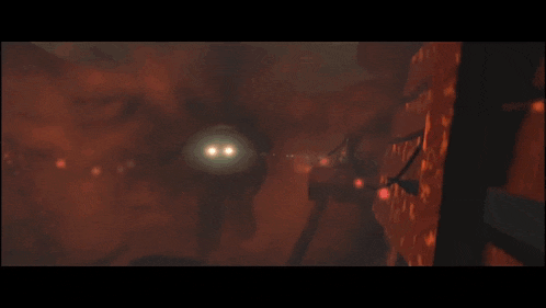 a man with glowing eyes walking through a dark room