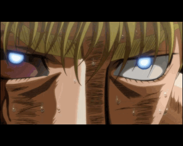 a close up of a person 's face with a blue eye