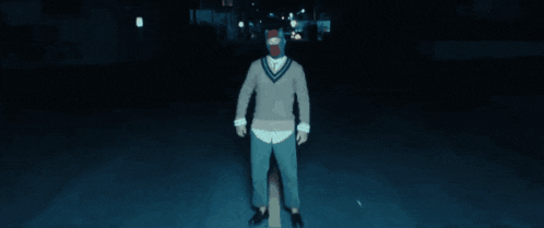 a person wearing a mask with a red and white stripe on it