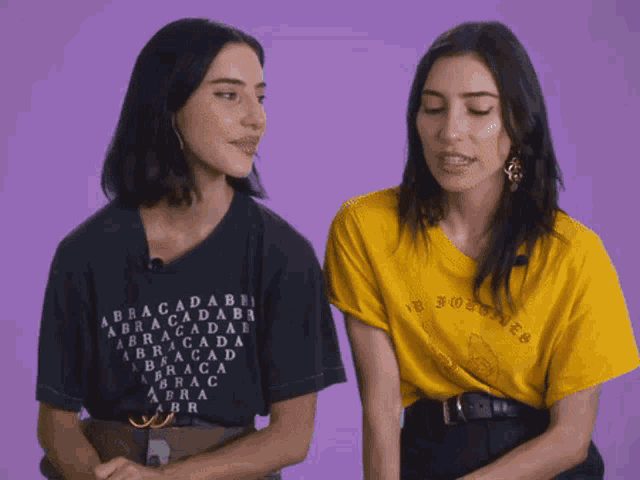 a woman wearing a black shirt that says abracadabra