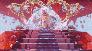 a staircase leading up to a stage with a heart shaped decoration in the background