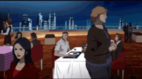 a group of people are sitting at a table in a restaurant