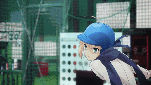a girl wearing a blue helmet and scarf is standing in front of a scoreboard