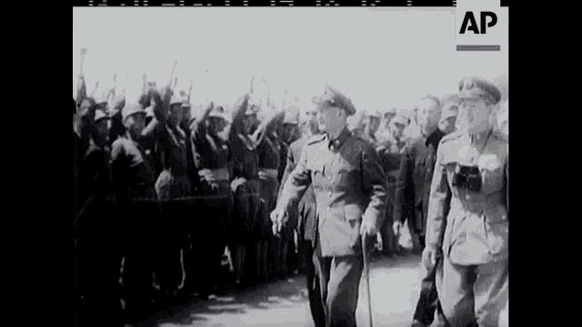 a black and white photo of a group of soldiers with the ap logo in the corner