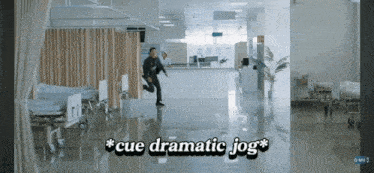 a man is running in a hospital hallway with the words cue dramatic jog