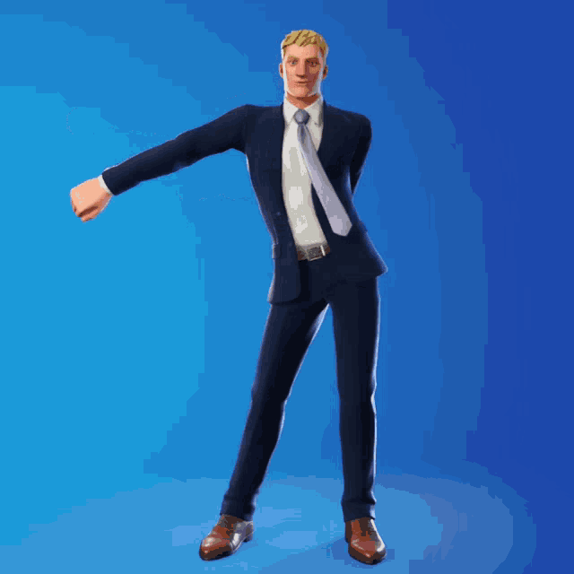 a man in a suit and tie is standing with his fist in the air