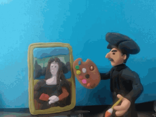 a man is holding a palette and a brush in front of a picture of a woman