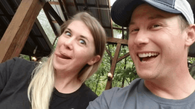 a man and a woman are making funny faces for the camera