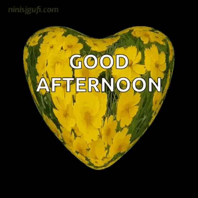 a heart shaped pillow with yellow flowers on it and the words good afternoon