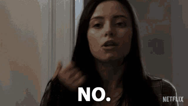 a woman in a plaid shirt says no