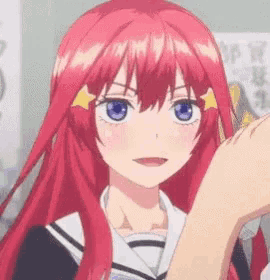 a girl with red hair and blue eyes is wearing a sailor suit .