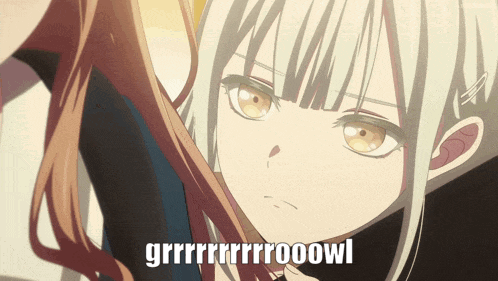 a close up of a girl 's face with the words grrrrrrrooowl below her