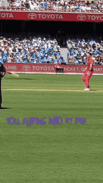 a toyota ad can be seen on the side of a stadium