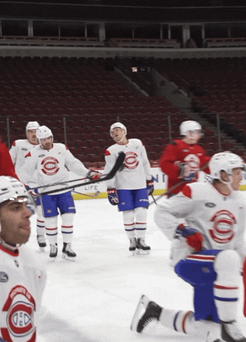a group of hockey players are on the ice and one of their jerseys says montreal
