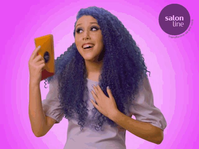 a woman with blue hair is holding a book in front of a salon line advertisement