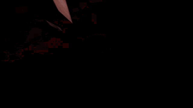 a red background with a glowing object in the middle