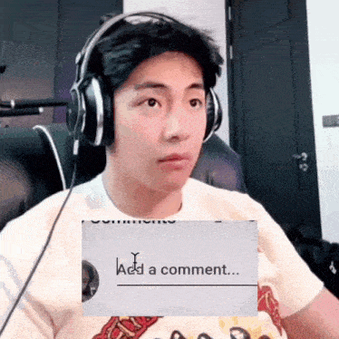 a man wearing headphones is sitting in front of a screen that says add a comment ..