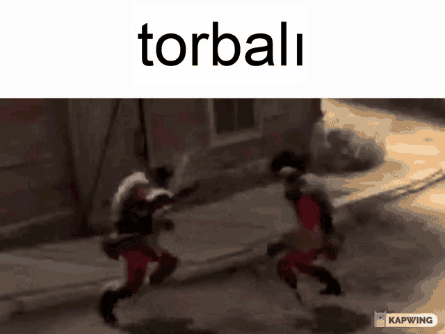 a video of two men fighting with the word torbali on the bottom