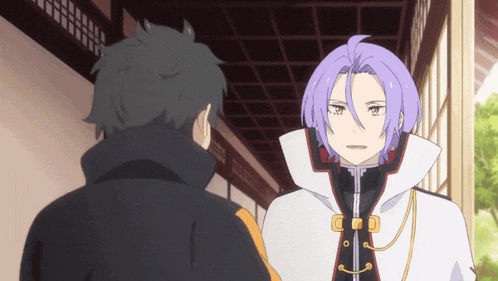 a man with purple hair is talking to another man with black hair