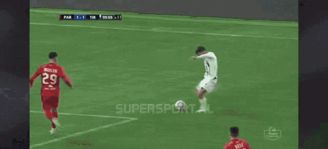 a soccer game is being played on a supersport.al screen