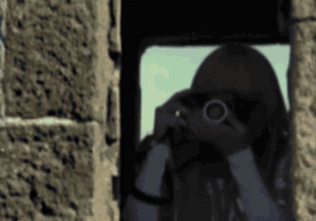 a woman is taking a picture of herself in a mirror