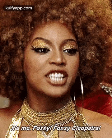 a close up of a woman 's face with a gold necklace and afro .