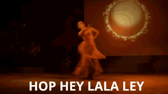 a blurred image of a person dancing with the words hop hey lala ley below them