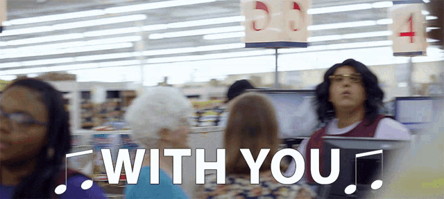 a woman in a store with the words " with you " on the bottom